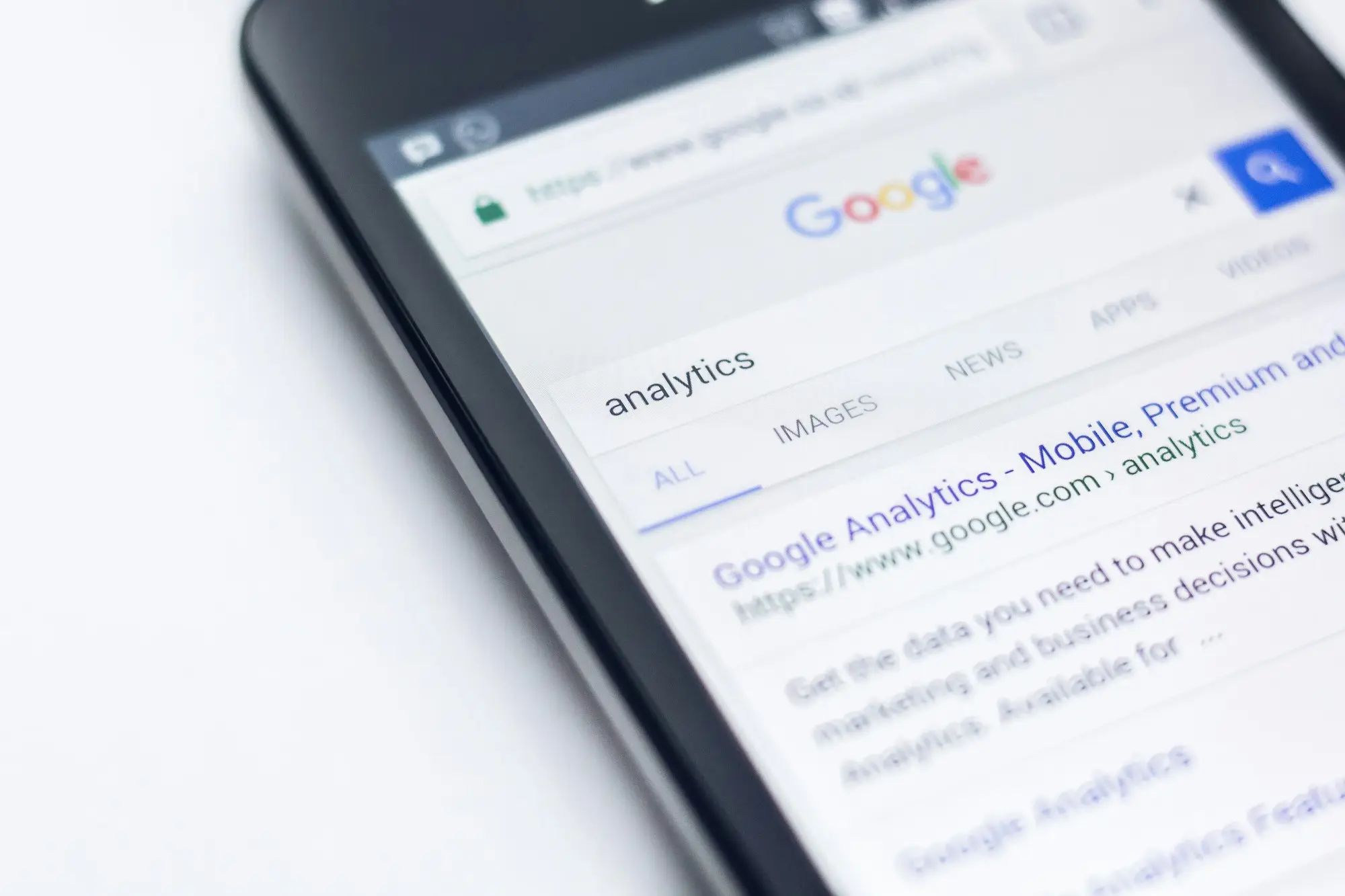 A smartphone showing a Google search results page for analytics