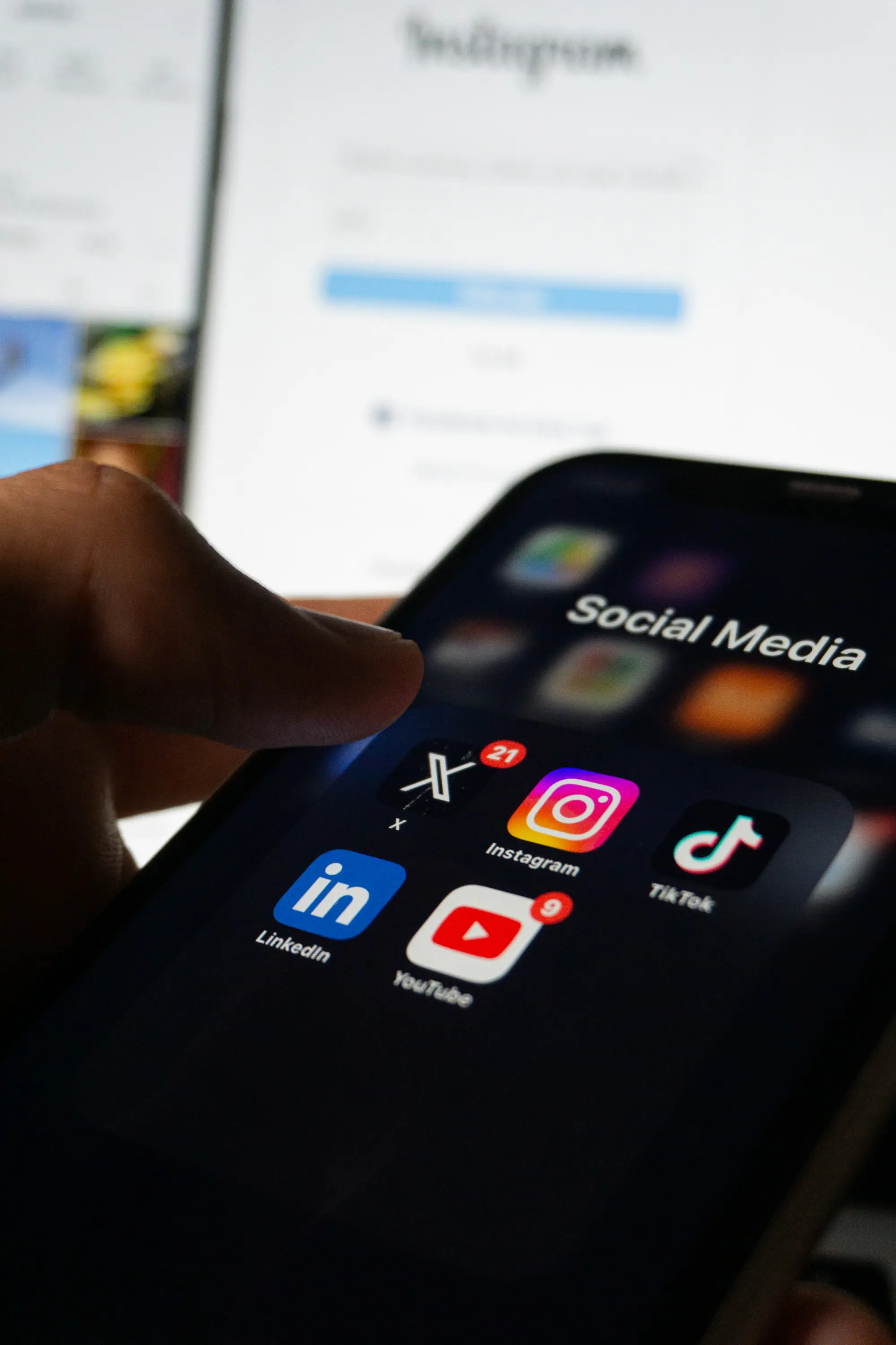 A smartphone screen showing a folder of social media app icons